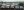 A photo of Delta's vans lined up outside their workshop